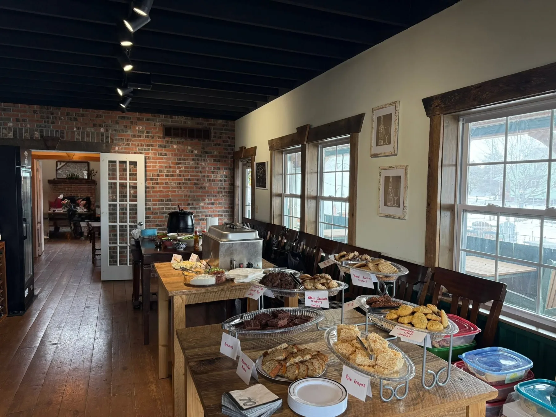 Warm dining room at The Mockingbird set with a buffet of homemade food